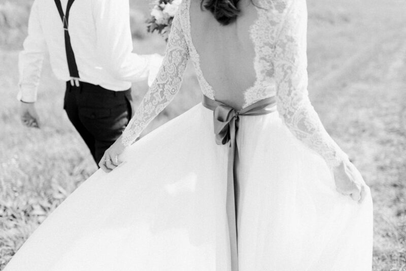 bride-groom-walking-field