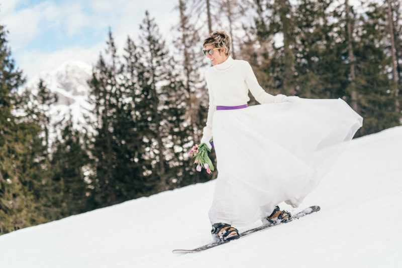 down the slopes bride dressed in white