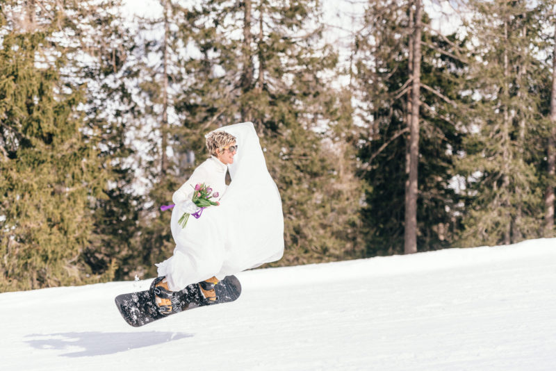 bride airing with a snowboard